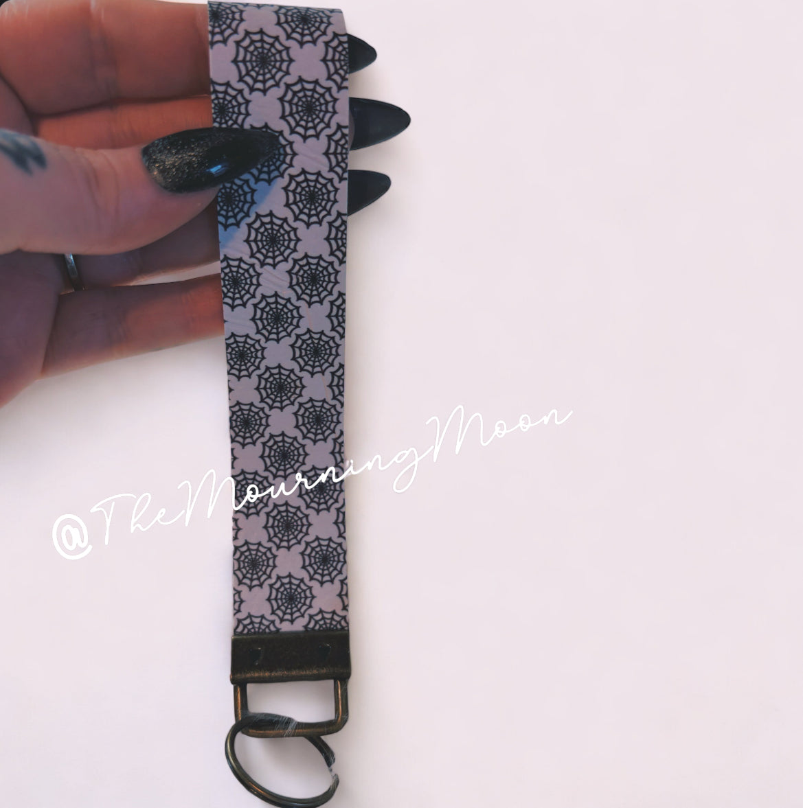 Spiderweb faux leather wristlet